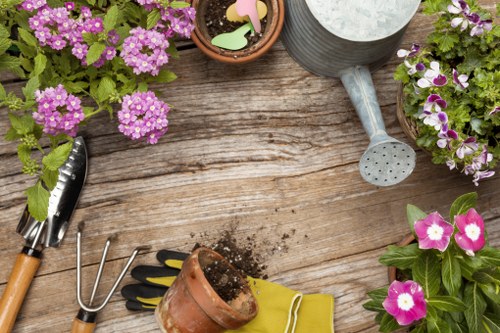 Gardener working on a front garden in Enfield terrace